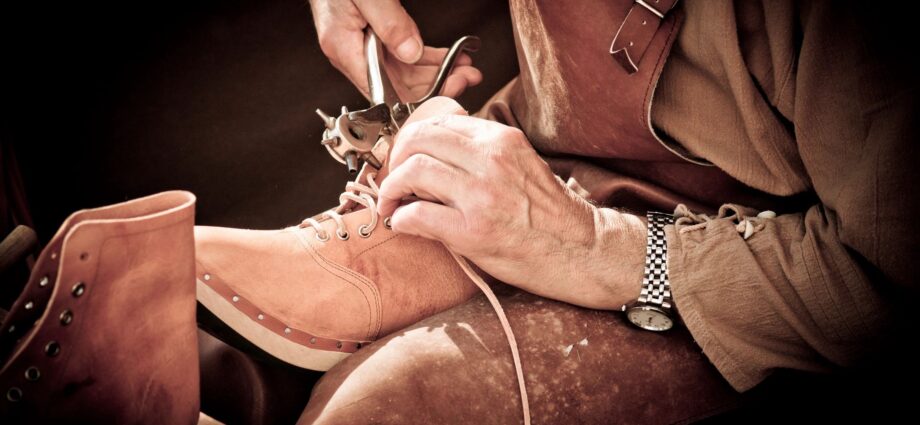 Man fixing shoe